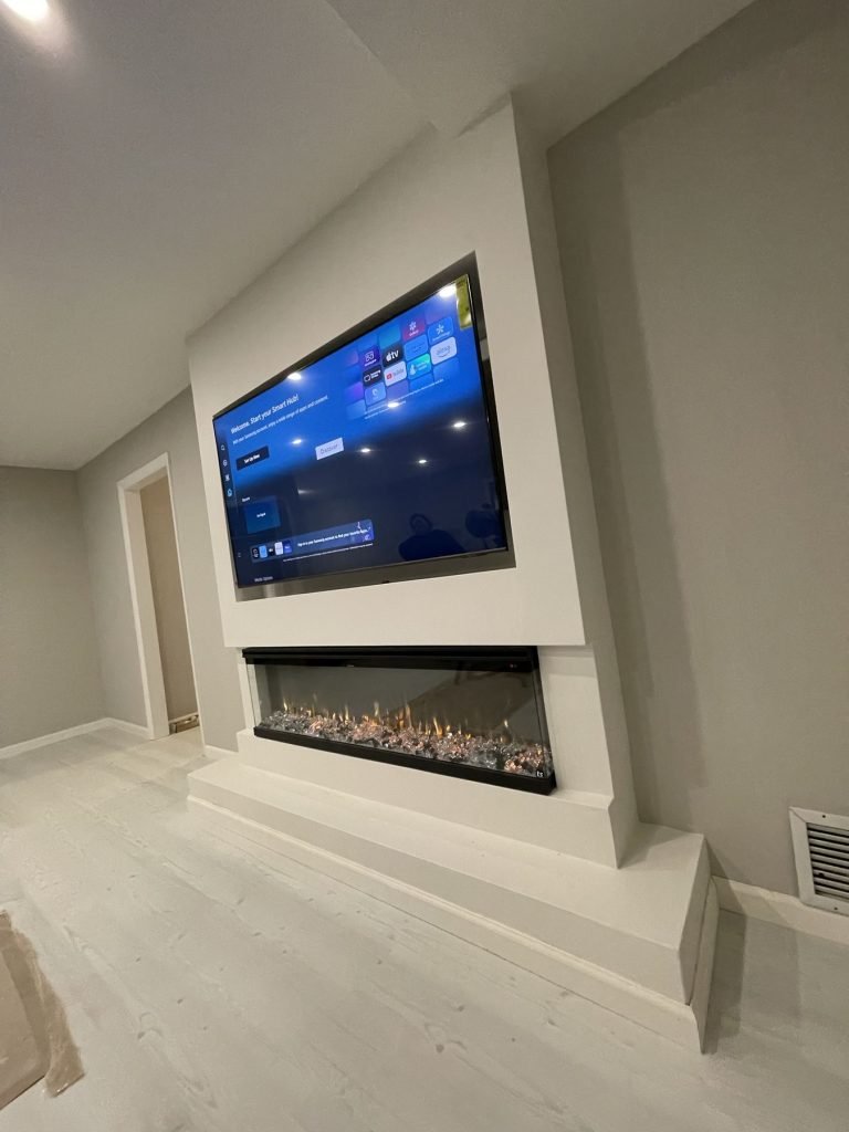 Basement family room with custom media wall and fireplace