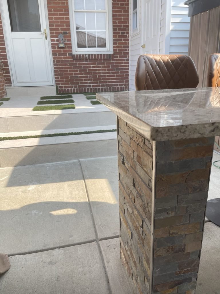 Backyard granite bar with stacked stone base and seating