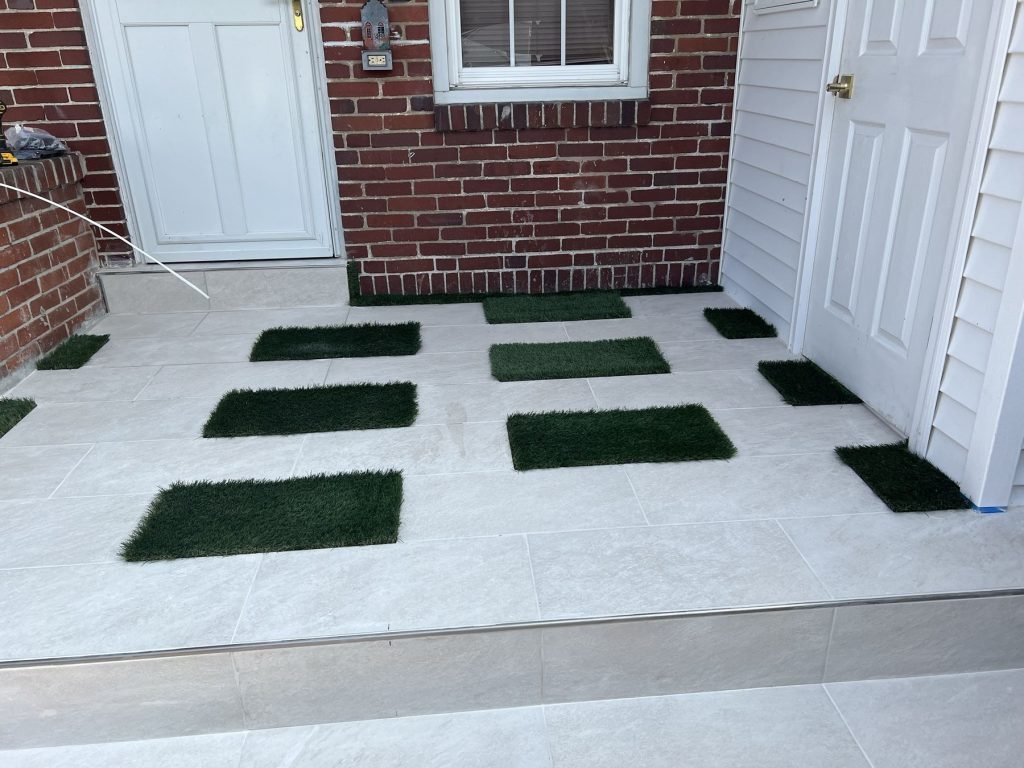 Concrete patio pavers with turf joints