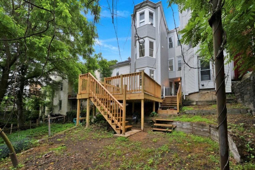 Pressure-treated deck and staircase on a three-story rowhouse