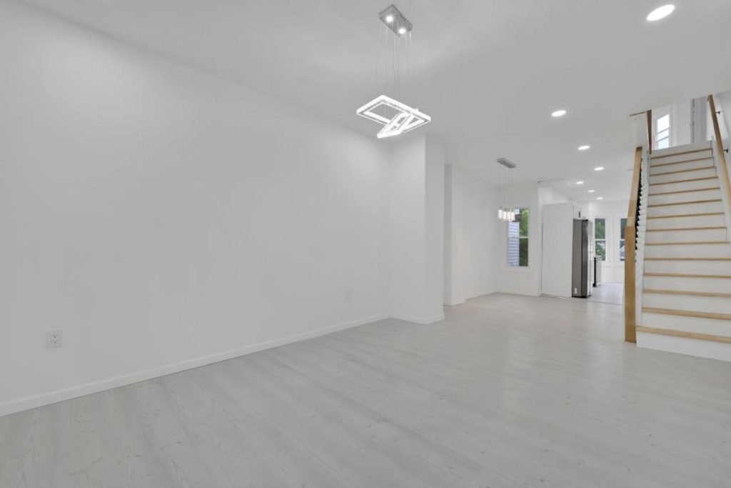 Renovated rowhouse hallway leading to new staircase