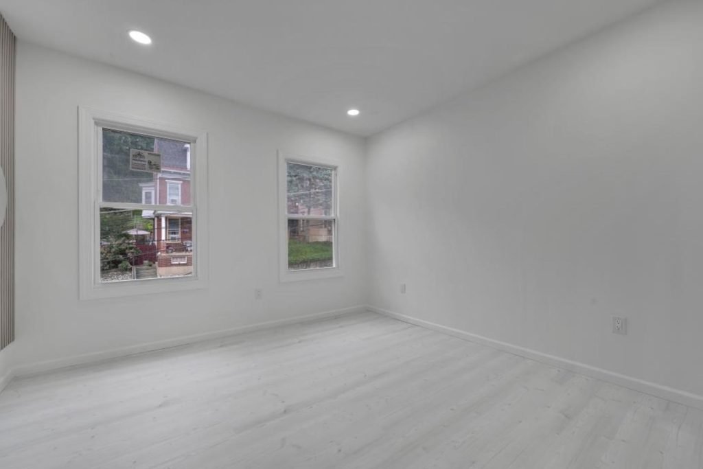 Freshly renovated bedroom with new windows and floors